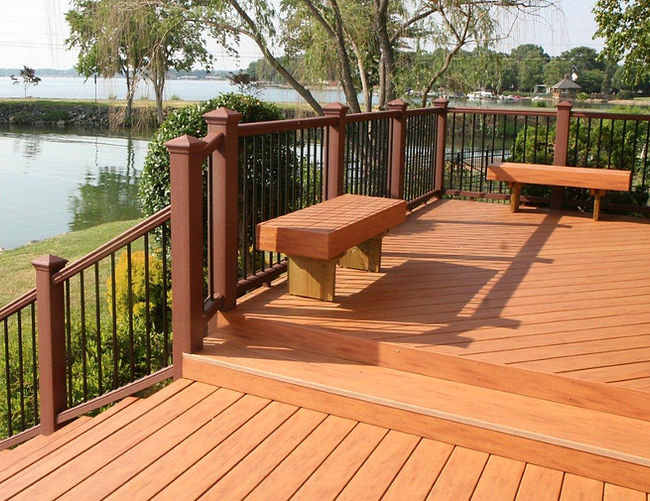 woodplus microshield on a deck with benches with pond in distance